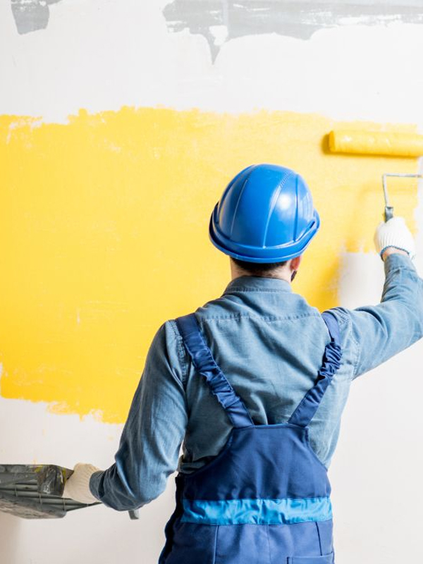 Experienced Residential Painters Brisbane applying wall paint